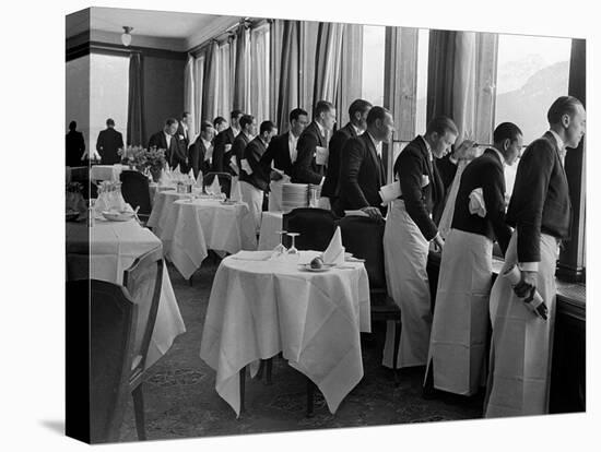 Waiters at the Grand Hotel Line Up at the Windows to Watch Sonja Henie Ice Skate Outside-Alfred Eisenstaedt-Stretched Canvas