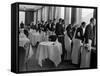 Waiters at the Grand Hotel Line Up at the Windows to Watch Sonja Henie Ice Skate Outside-Alfred Eisenstaedt-Framed Stretched Canvas