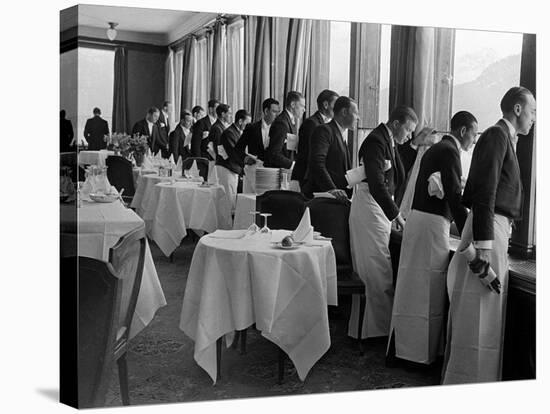 Waiters at the Grand Hotel Line Up at the Windows to Watch Sonja Henie Ice Skate Outside-Alfred Eisenstaedt-Stretched Canvas