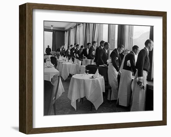 Waiters at the Grand Hotel Line Up at the Windows to Watch Sonja Henie Ice Skate Outside-Alfred Eisenstaedt-Framed Photographic Print