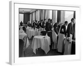 Waiters at the Grand Hotel Line Up at the Windows to Watch Sonja Henie Ice Skate Outside-Alfred Eisenstaedt-Framed Photographic Print