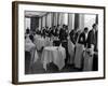 Waiters at the Grand Hotel Line Up at the Windows to Watch Sonja Henie Ice Skate Outside-Alfred Eisenstaedt-Framed Photographic Print