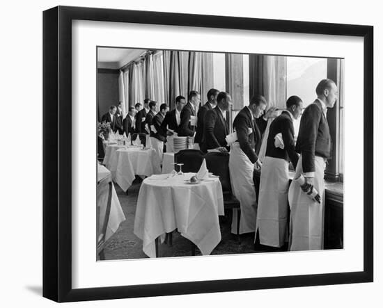 Waiters in the Grand Hotel Dining Room Lined Up at Window Watching Sonia Henie Ice Skating Outside-Alfred Eisenstaedt-Framed Photographic Print