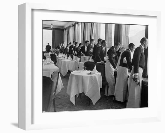 Waiters in the Grand Hotel Dining Room Lined Up at Window Watching Sonja Henie Ice Skating Outside-Alfred Eisenstaedt-Framed Photographic Print