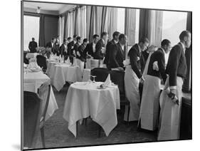 Waiters in the Grand Hotel Dining Room Lined Up at Window Watching Sonja Henie Ice Skating Outside-Alfred Eisenstaedt-Mounted Photographic Print
