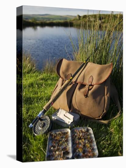 Wales, Conwy, A Trout Rod and Fly Fishing Equipment Beside a Hill Lake in North Wales, UK-John Warburton-lee-Stretched Canvas