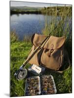Wales, Conwy, A Trout Rod and Fly Fishing Equipment Beside a Hill Lake in North Wales, UK-John Warburton-lee-Mounted Photographic Print