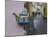 Wall Decorated with Teapot and Cobbled Street in the Old Town, Vilnius, Lithunia-Keren Su-Mounted Photographic Print
