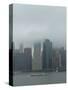 Wall Street office towers with fog and East River boat traffic-Jan Halaska-Stretched Canvas