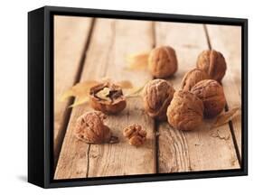 Walnuts on a Wooden Background-Matthias Hoffmann-Framed Stretched Canvas