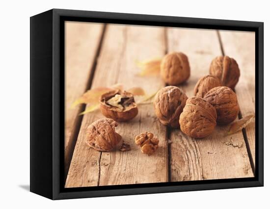 Walnuts on a Wooden Background-Matthias Hoffmann-Framed Stretched Canvas