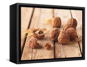 Walnuts on a Wooden Background-Matthias Hoffmann-Framed Stretched Canvas