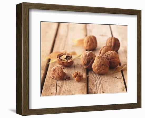 Walnuts on a Wooden Background-Matthias Hoffmann-Framed Photographic Print