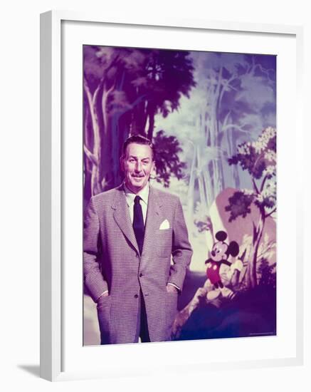 Walt Disney Posing Against Landscape Backdrop Containing Mickey Mouse-Alfred Eisenstaedt-Framed Premium Photographic Print