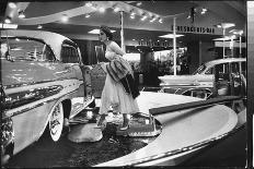 Model Gingerly Traversing Stepping Stones to Get to La Parisienne Pontiac Hard Top Car on Display-Walter Sanders-Photographic Print