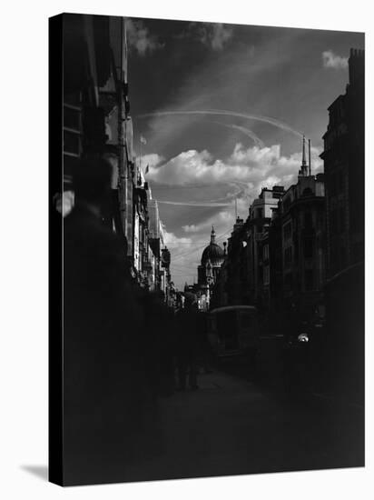 War Plane Contrails in the London Sky-null-Stretched Canvas