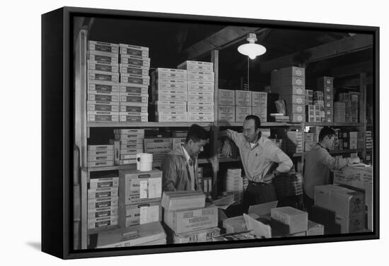 Warehouse manager M. Ogi with S. Sugimoto, manager of Co-op at Manzanar, 1943-Ansel Adams-Framed Stretched Canvas