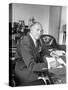 Warner Bros. Studio Chief Jack Warner Sitting at His Desk-Alfred Eisenstaedt-Stretched Canvas