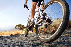 Low Angle View Of Cyclist Riding Mountain Bike On Rocky Trail At Sunrise-warrengoldswain-Photographic Print