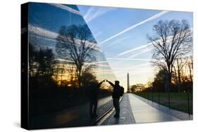 Washington DC - A Veteran Looks for a Name at Vietnam Veterans Memorial Wall at Sunrise-Orhan-Stretched Canvas