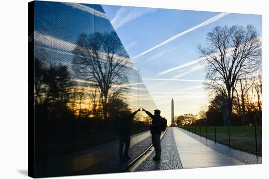 Washington DC - A Veteran Looks for a Name at Vietnam Veterans Memorial Wall at Sunrise-Orhan-Stretched Canvas