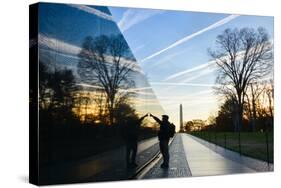 Washington DC - A Veteran Looks for a Name at Vietnam Veterans Memorial Wall at Sunrise-Orhan-Stretched Canvas