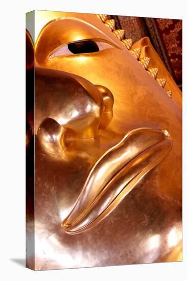 Wat Pho (Temple of the Reclining Buddha), detail of face of big reclining golden Buddha statue-Godong-Stretched Canvas