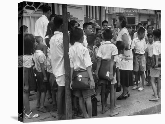 "Watchtower", Being Distributed in Streets of Bangkok-null-Stretched Canvas