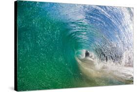 Water shot of a tubing wave off a Hawaiian beach-Mark A Johnson-Stretched Canvas