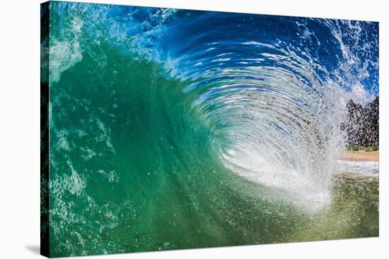 Water shot of a tubing wave off a Hawaiian beach-Mark A Johnson-Stretched Canvas