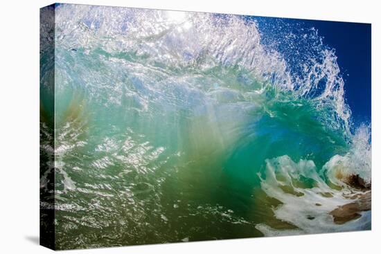 Water shot of a tubing wave off a Hawaiian beach-Mark A Johnson-Stretched Canvas