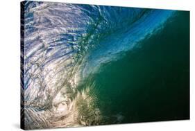 Water shot of a tubing wave off a Hawaiian beach-Mark A Johnson-Stretched Canvas