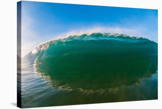 Water shot of a tubing wave off a Hawaiian beach-Mark A Johnson-Stretched Canvas