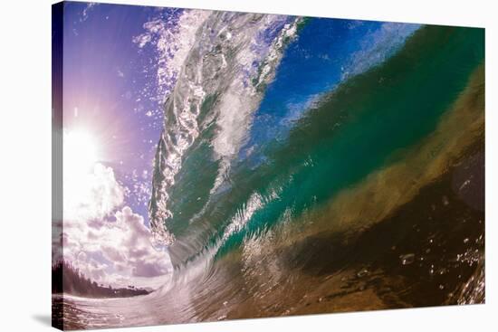 Water shot of a tubing wave off a Hawaiian beach-Mark A Johnson-Stretched Canvas