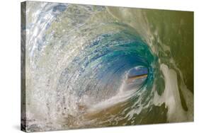 Water shot of a tubing wave off a Hawaiian beach-Mark A Johnson-Stretched Canvas