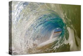 Water shot of a tubing wave off a Hawaiian beach-Mark A Johnson-Stretched Canvas