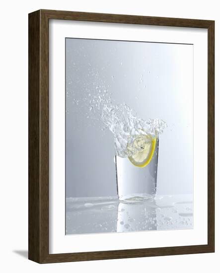 Water Splashing Out of a Glass-Karl Newedel-Framed Photographic Print