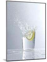 Water Splashing Out of a Glass-Karl Newedel-Mounted Photographic Print