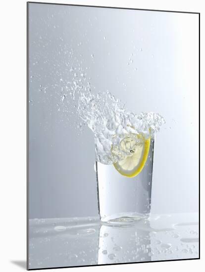 Water Splashing Out of a Glass-Karl Newedel-Mounted Photographic Print