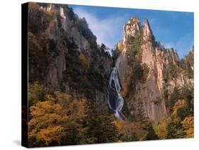 Waterfall cascading down cliff, Sounkyo, Hokkaido, Japan-Aso Fujita-Stretched Canvas