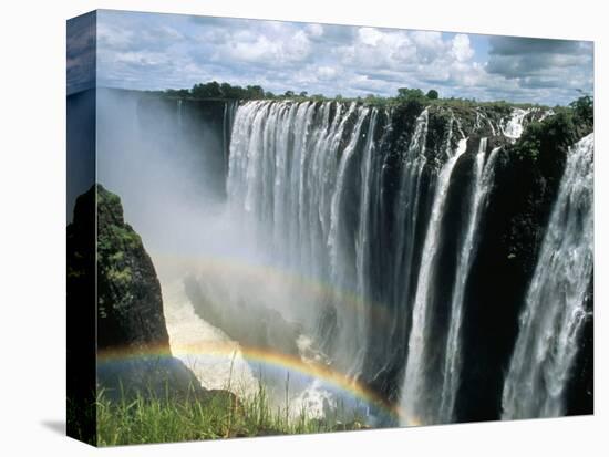 Waterfalls and Rainbows, Victoria Falls, Unesco World Heritage Site, Zambia, Africa-D H Webster-Stretched Canvas