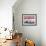 Waterfront Scene at Huanchaco in Peru, Locals Relax Next to Totora Boats Stacked Along the Beach-Andrew Watson-Framed Photographic Print displayed on a wall