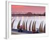 Waterfront Scene at Huanchaco in Peru, Locals Relax Next to Totora Boats Stacked Along the Beach-Andrew Watson-Framed Photographic Print