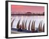 Waterfront Scene at Huanchaco in Peru, Locals Relax Next to Totora Boats Stacked Along the Beach-Andrew Watson-Framed Photographic Print