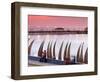 Waterfront Scene at Huanchaco in Peru, Locals Relax Next to Totora Boats Stacked Along the Beach-Andrew Watson-Framed Photographic Print