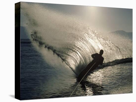 Waterskier Silhouetted with Sun Shining Through Water-null-Stretched Canvas