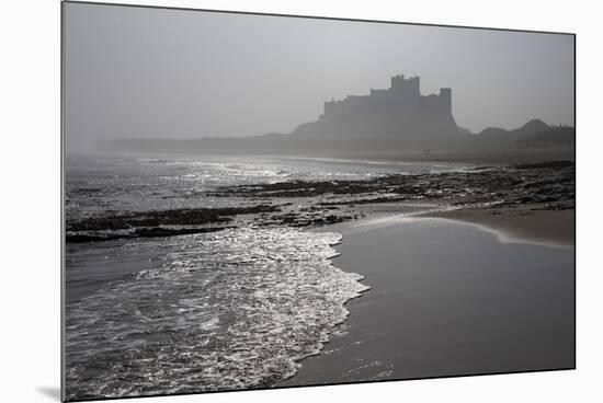 Waves Breaking at Bamburgh Beach Looking Towards Bamburgh Castle on a Misty Morning-Ann and Steve Toon-Mounted Photographic Print