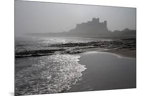 Waves Breaking at Bamburgh Beach Looking Towards Bamburgh Castle on a Misty Morning-Ann and Steve Toon-Mounted Photographic Print