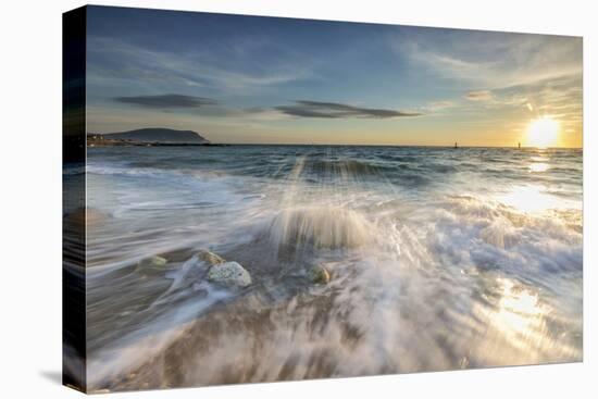 Waves crashing on the sandy beach framed by sunrise, Porto Recanati, Conero Riviera, Marche, Italy-Roberto Moiola-Stretched Canvas