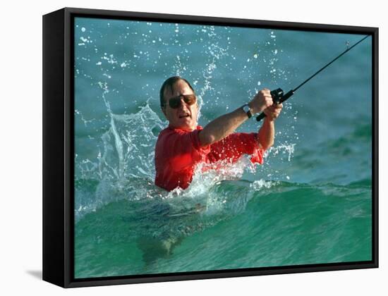 Waves Splash President-Elect George Bush as He Casts a Line While Surf-Fishing-null-Framed Stretched Canvas